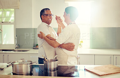 Buy stock photo Senior, couple and dancing with love in kitchen for bonding, romantic connection and together for relationship. Man, woman and sweet embrace in home with rhythm for affection, care and compassion.