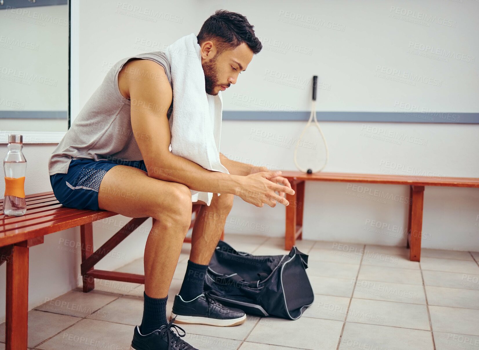 Buy stock photo Disappointed, athlete and man in gym, towel and squash player with bag, serious and competition for health. Concentration, relax and practice of sports for male person, commitment with fitness