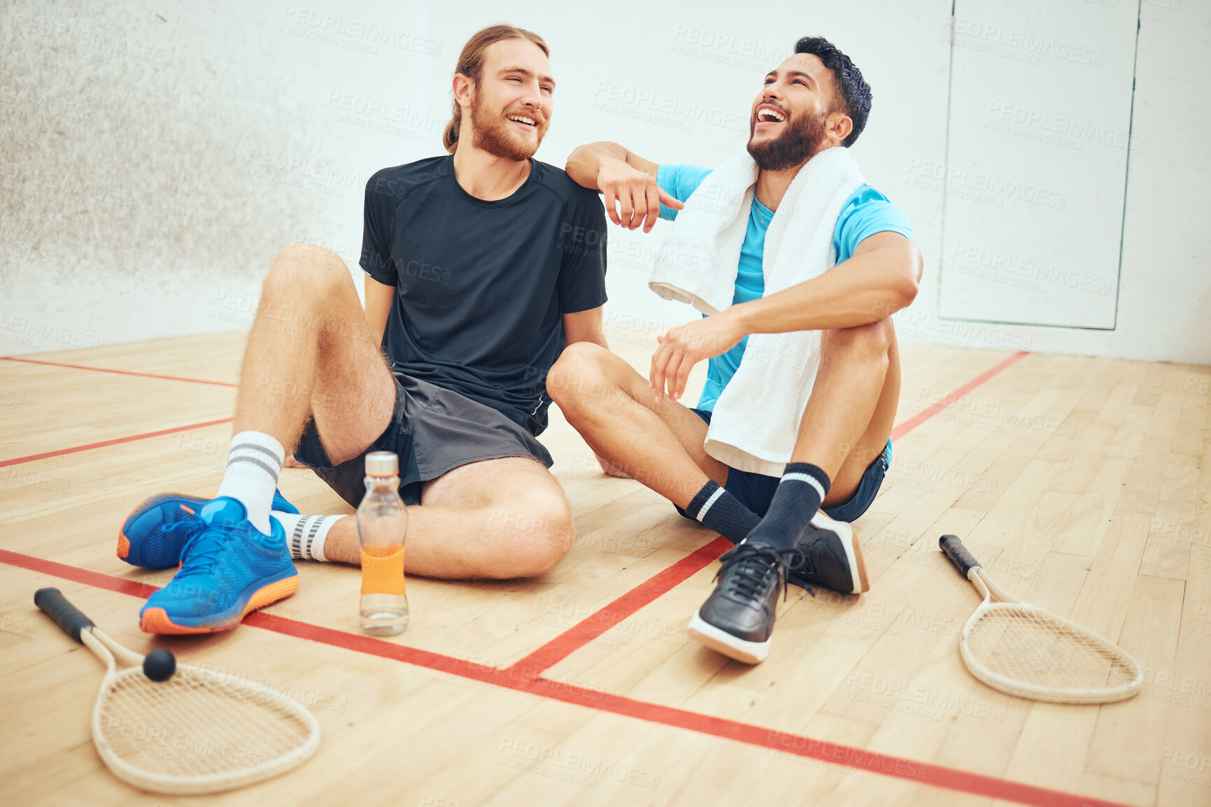 Buy stock photo Laughing, athlete and people in court, break and teamwork for playing in sports, training and practice. Fitness, sportsman and relax for tournament, squash player and fun of exercise and joke