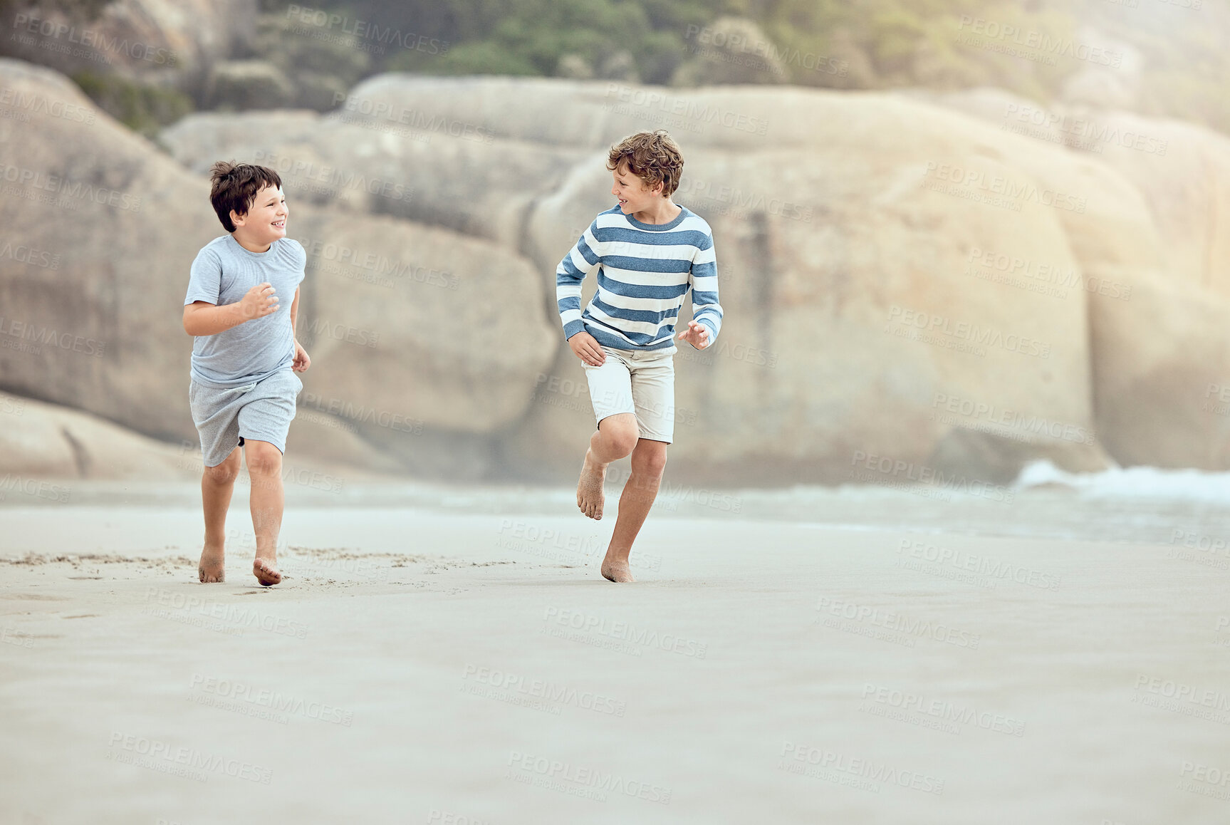 Buy stock photo Fun, running and boys in beach, outdoor and siblings in nature, energy and games for bonding in vacation. Holiday, water and kids in summer to relax, playing and family in ocean, sand and trip