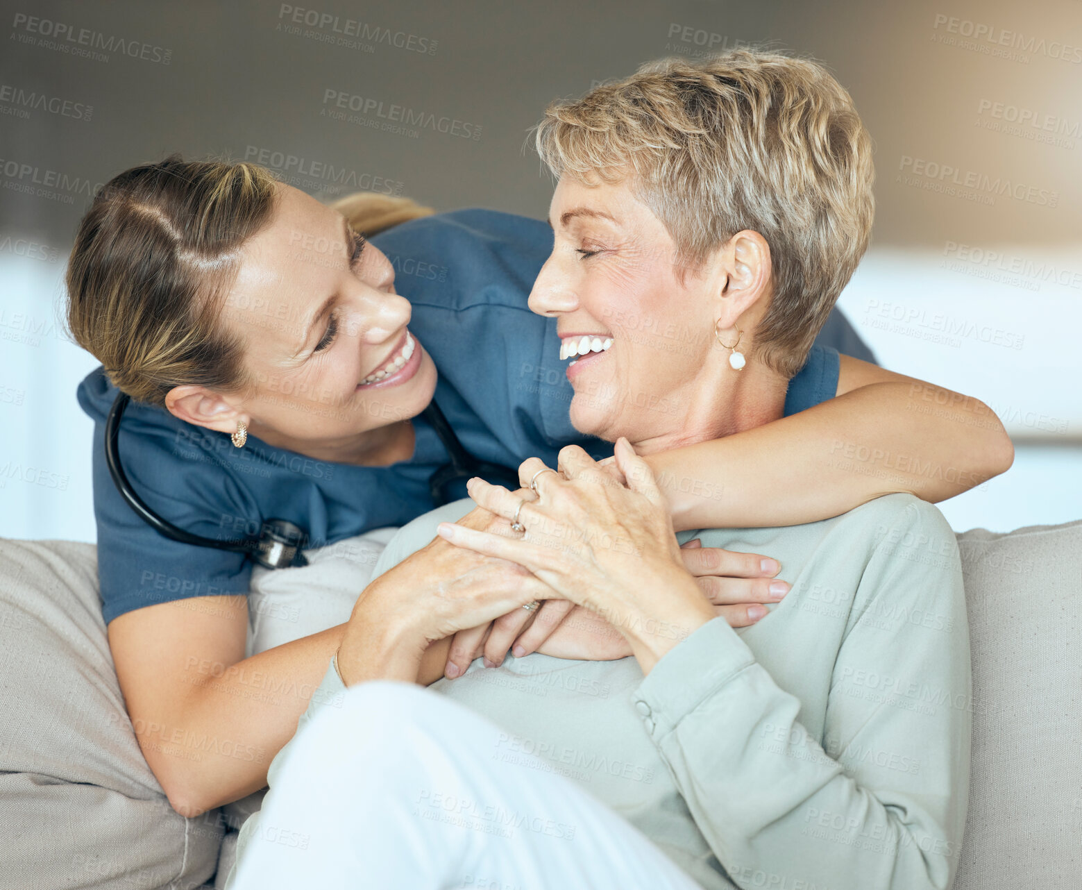 Buy stock photo Hug, support or visit with nurse and mature woman on sofa in living room of home for healthcare or occupational therapy. Laughing, medical or rehab with patient and therapist in apartment together