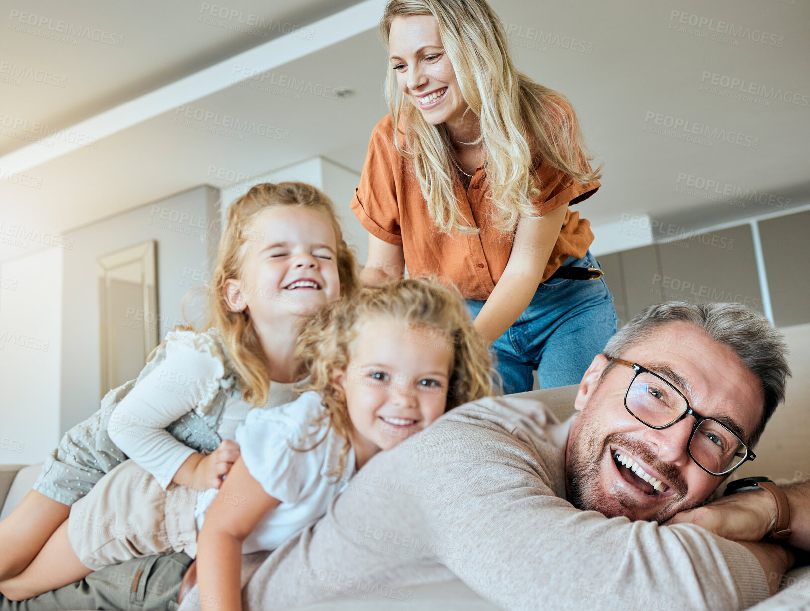 Buy stock photo Bonding, family and and portrait in lounge, parents and happy with love for daughter, girls and fun. Home, kids and mom in living room, woman and man with child, smile and embrace for care and games