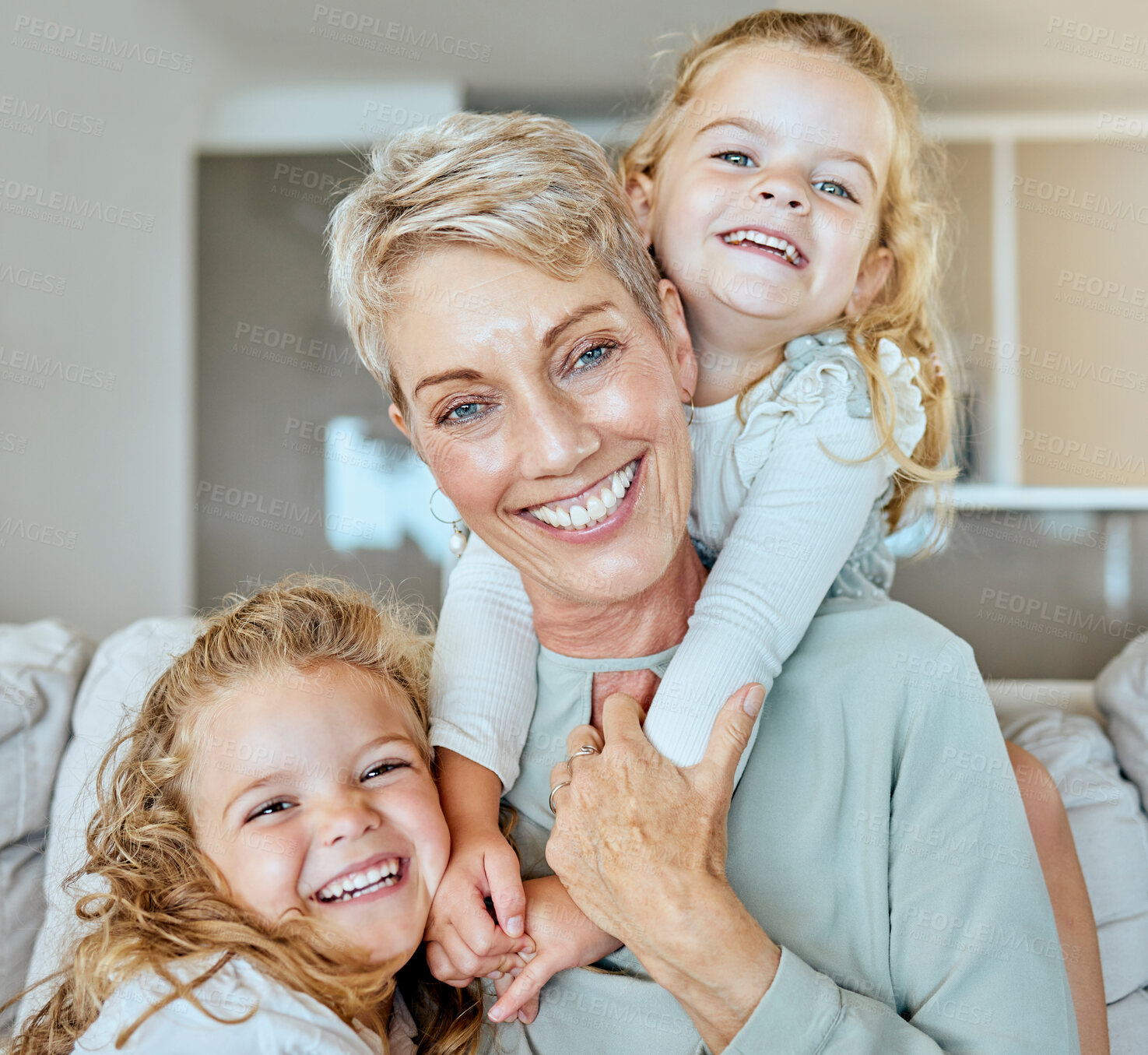 Buy stock photo Portrait, happy and senior woman with children on sofa to relax, family bonding and support for love at house. Smile, grandmother and kids with embrace for trust, security and care of hug together