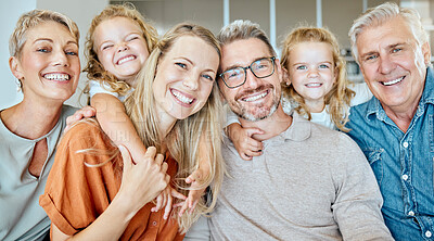 Buy stock photo Bonding, big family and portrait in lounge, grandparents and happy with love for daughter, girls and hug. Home, kids and mom in living room, woman and man with child, smile and embrace for care