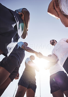 Buy stock photo Rugby, men and handshake of team with below, confidence and pride in competitive game. Fitness, sports and teamwork, proud players ready for match, workout or tournament on field at health club