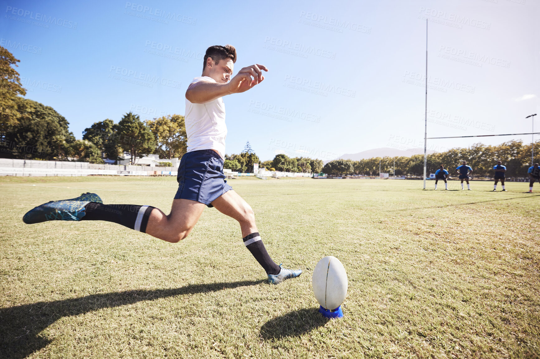 Buy stock photo Rugby, action and man kick ball on field for match, tournament or conversion training. Fitness, sports and male athlete with motion for technique, challenge or score between goal post in game