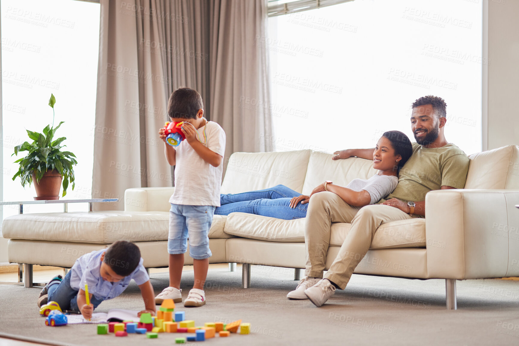 Buy stock photo Toys, playing and children with parents relax in home on weekend for bonding and family time. Rest, living room and mom and dad watching kids with blocks for learning, development or growth at house.