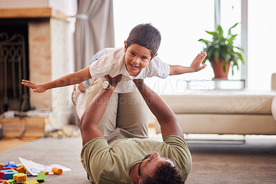 Buy stock photo Home, dad and portrait of child with airplane on floor for freedom, balance and bonding in childhood. Happy, father and son with game by toys in living room for love, care and imagination of flight