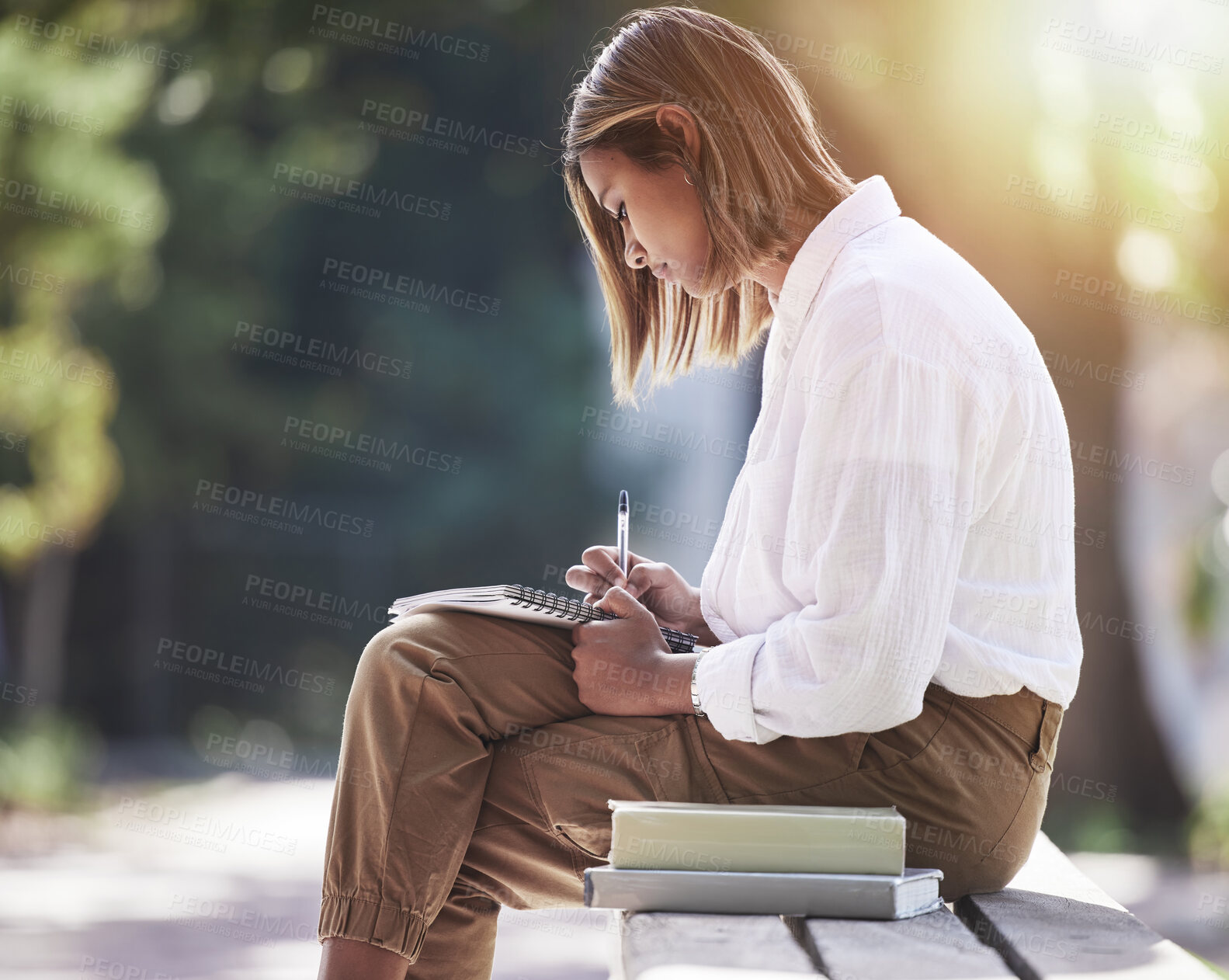 Buy stock photo Woman, writing and student with books at park outdoor to study for future in business management. Studying, learning or knowledge of a young female person in nature with notebook for school education