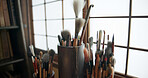 Paint brush, equipment and supplies in empty studio closeup for art, creative or talent showcase. Workshop interior or room with still life objects for artistic creativity or artwork drawing