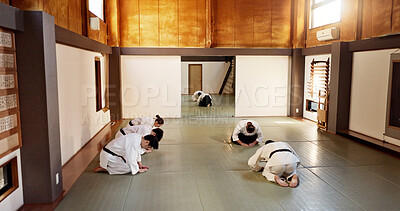 Buy stock photo Japanese people, training and learning martial arts in dojo place in fight and aikido class of self defence. Group, black belt students and fitness with teamwork, combat and discipline in respect