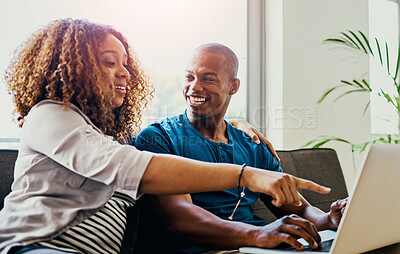 Buy stock photo Couple, pointing and laptop on sofa in home for movie choice, streaming and social media meme or video. Man, woman and happy on couch in house for bonding, relax and online shopping with decision