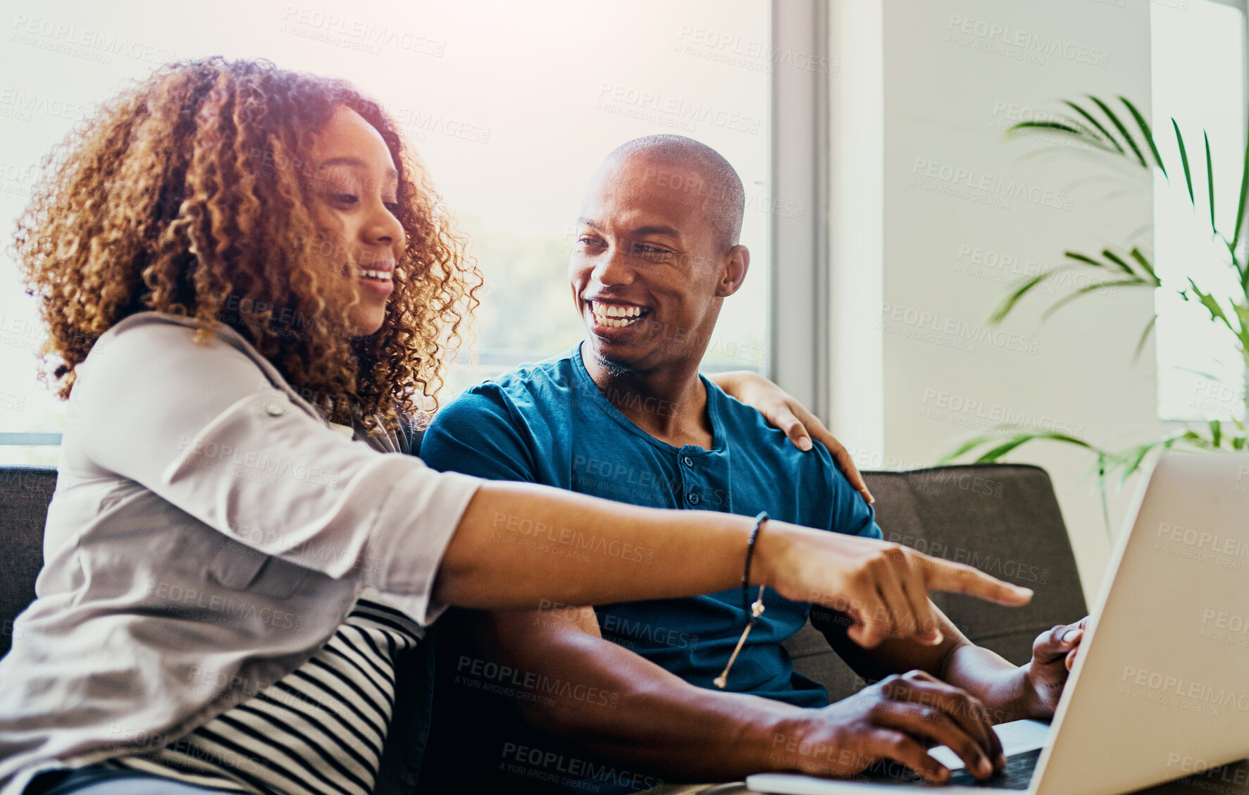 Buy stock photo Couple, pointing and laptop on sofa in home for movie choice, streaming and social media meme or video. Man, woman and happy on couch in house for bonding, relax and online shopping with decision