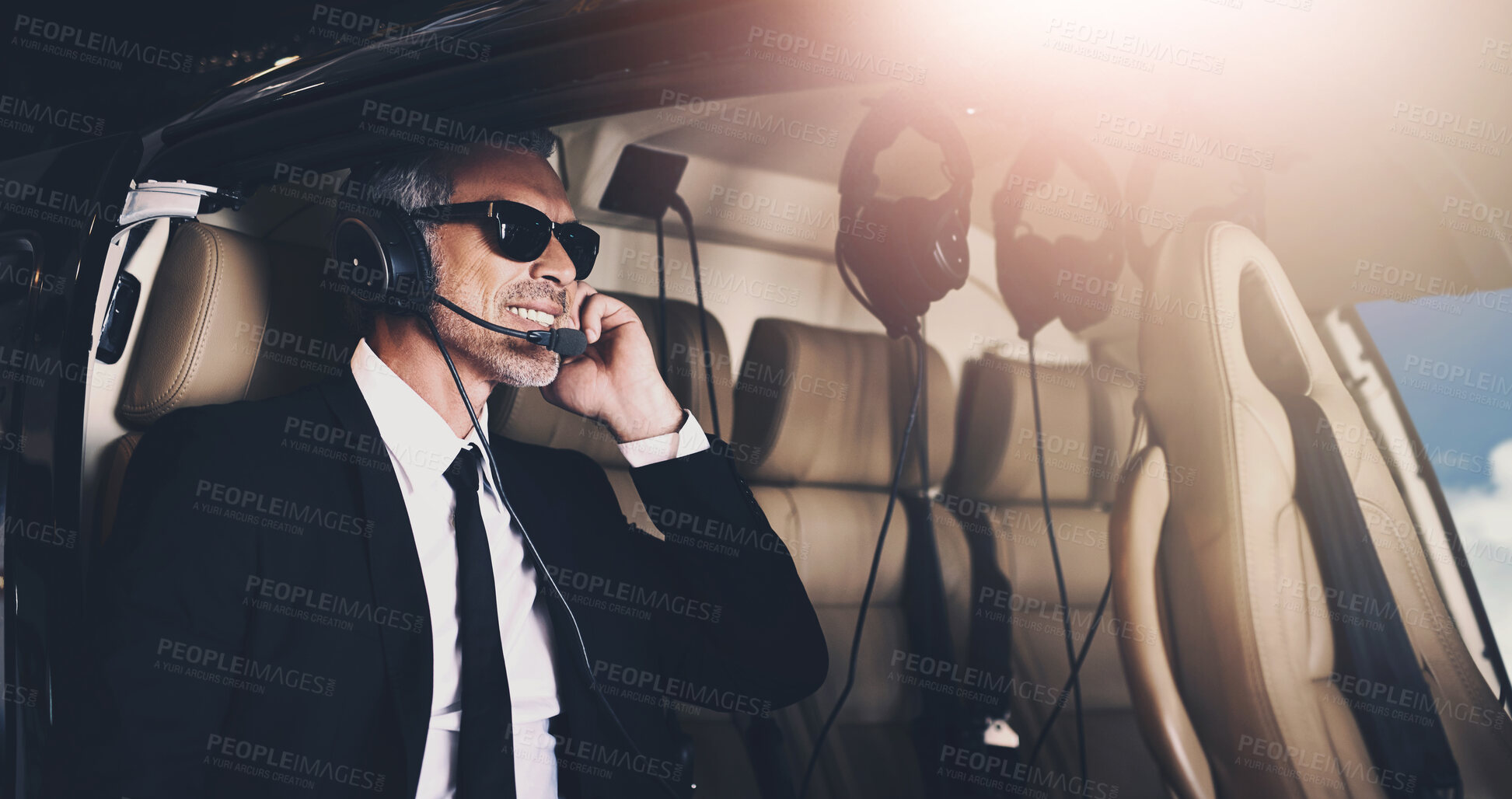 Buy stock photo Happy man, pilot and flying with headphones for travel or international trip for job or career opportunity on flight. Businessman with smile or headset on airplane for private journey or adventure