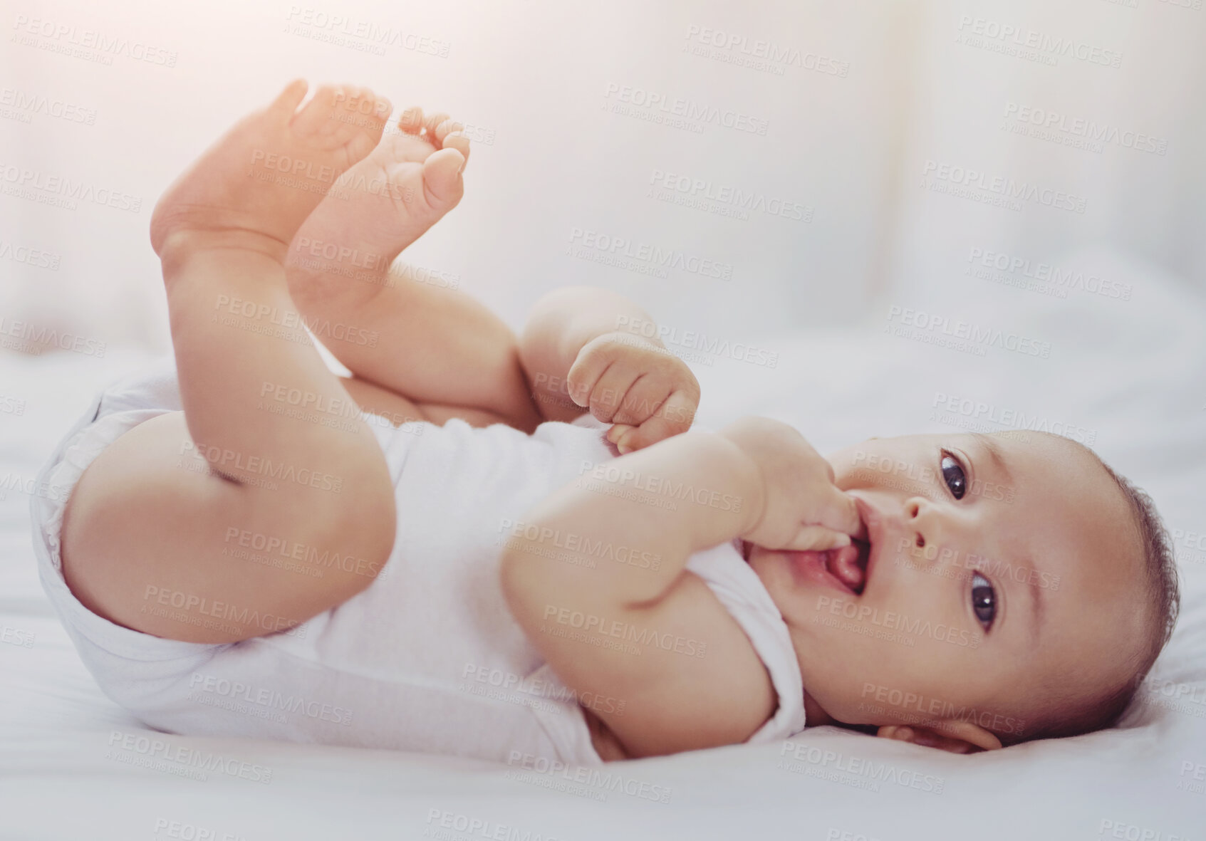 Buy stock photo Child, baby and portrait on bed with relax for wellness, healthy development or morning routine in home. Newborn, curious infant or teething in bedroom with resting, wake up or comfortable in nursery