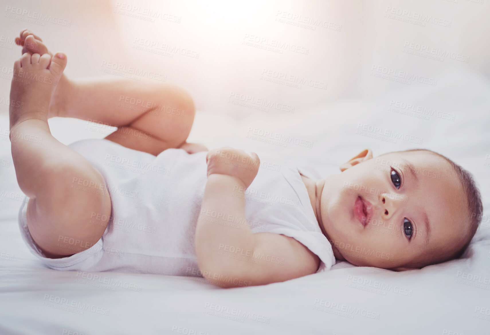 Buy stock photo Newborn, baby and portrait in bed with relax for wellness, healthy development and morning routine in home. Child, curious infant and face in bedroom with resting, wake up or comfortable in nursery