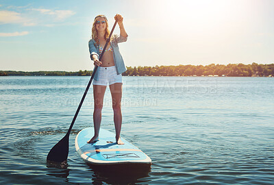 Buy stock photo Portrait, paddle and woman with surfboard, vacation and stress relief with hobby, getaway trip and break. Activity, girl person and water, summer holiday or travel with adventure, fitness or journey