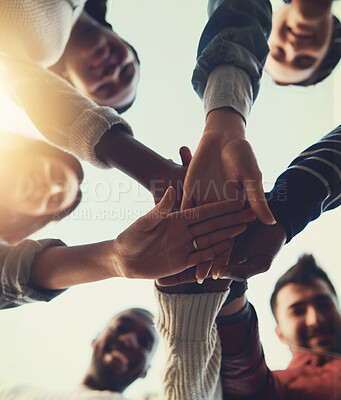 Buy stock photo Hands, huddle and solidarity with friends outdoor from below on sky for celebration, motivation or support. Circle, palm and unity with group of people together for community, partnership or trust