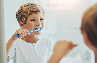 Buy stock photo Boy child, mirror or toothbrush in bathroom for cleaning teeth, oral care or hygiene in home. Male kid, reflection or whitening with toothpaste for morning routine or wellness, dental health in house