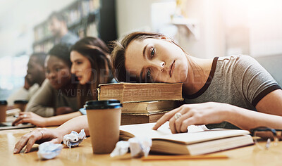 Buy stock photo Bored, coffee and portrait of student with books in library for education, learning or study. Exhausted, burnout and tired with face of girl at desk of college or university for classroom lesson