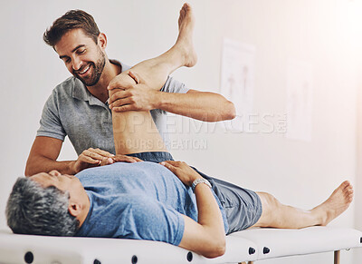 Buy stock photo Physiotherapist, senior man and massage bed for stretching, elderly care and wellness for muscle or fitness. Pensioner, male person and medic in appointment, rehabilitation clinic or retirement home
