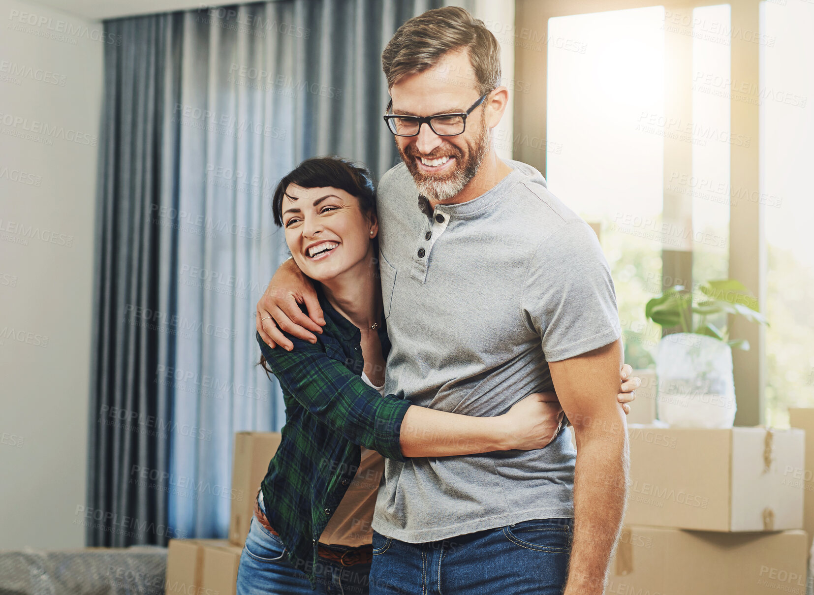 Buy stock photo Hug, moving and couple in new home with boxes for immigration together in Canada with marriage. Happy, cardboard and mature man and woman embrace for achievement of mortgage with property investment.