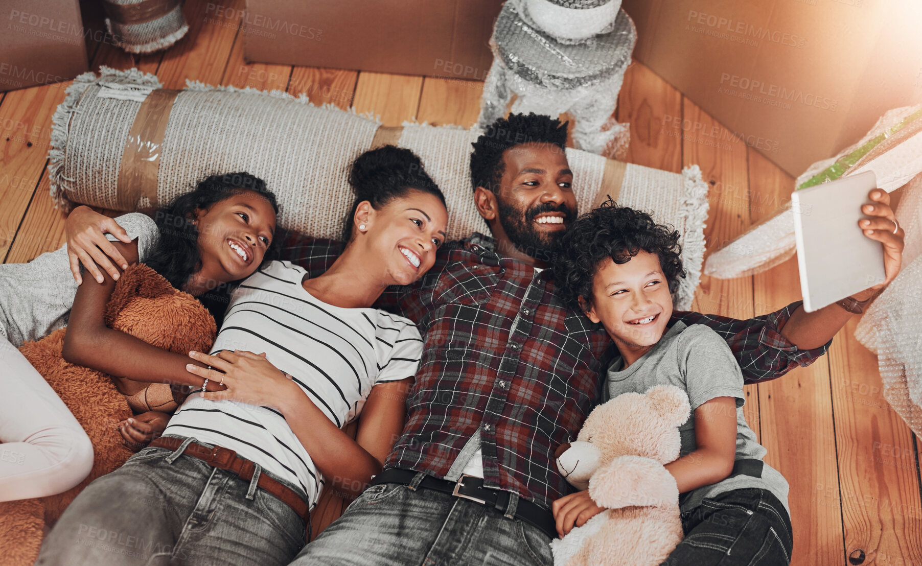 Buy stock photo Carpet, family and selfie on floor in new home to capture memory of growth or real estate investment. Love, milestone or property with mom, dad and children in living room of apartment from above