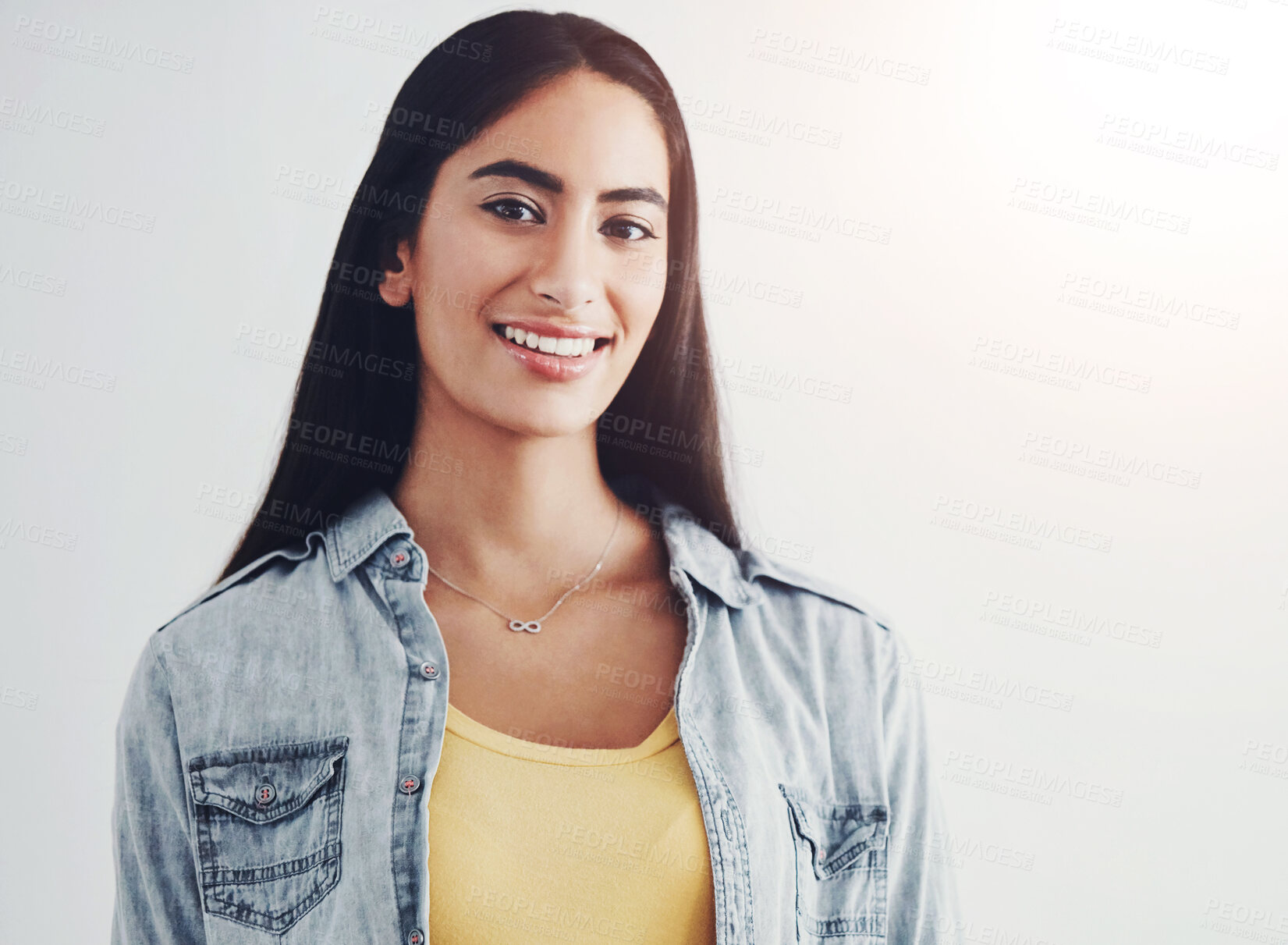 Buy stock photo Woman, portrait and smile with confidence in studio with mockup, casual fashion and relax. Model, person and face or positive on white background with pride, carefree and happy for trendy style