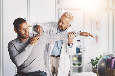 Buy stock photo Senior doctor, man and patient with shoulder pain for physical therapy, stretching and body recovery. Orthopedic, physician and medical expert for arm consultation with examination, advice or healing