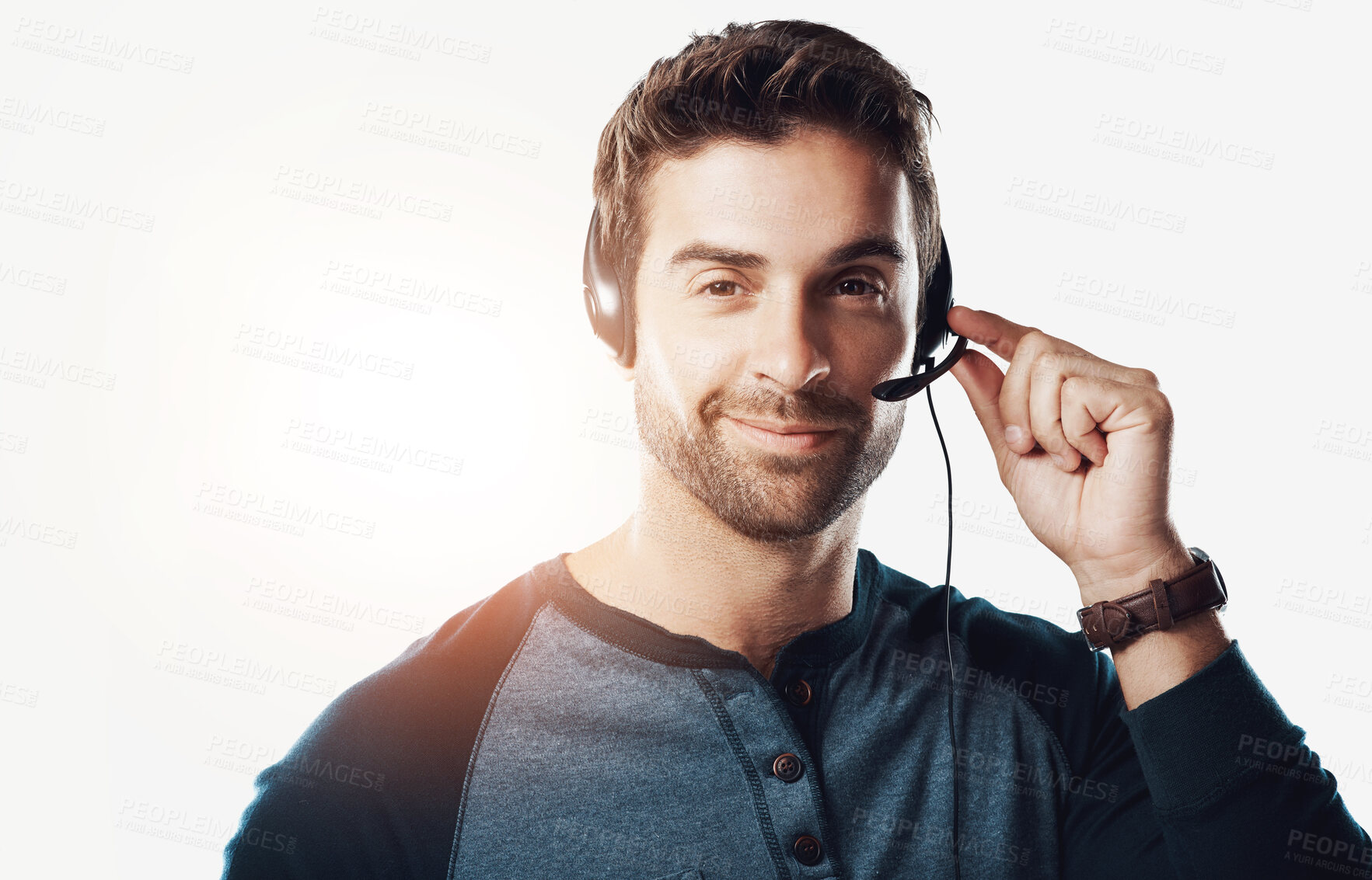 Buy stock photo Man, headset and smile in studio as call center agent in white background for customer service.  Employee, portrait and confident with microphone for crm with pride for client support and advice