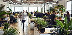 Business, walking and people in office, leaves and arriving in workspace of coworking, table and startup. Workplace, interior design and architecture of building, colleagues and busy in morning