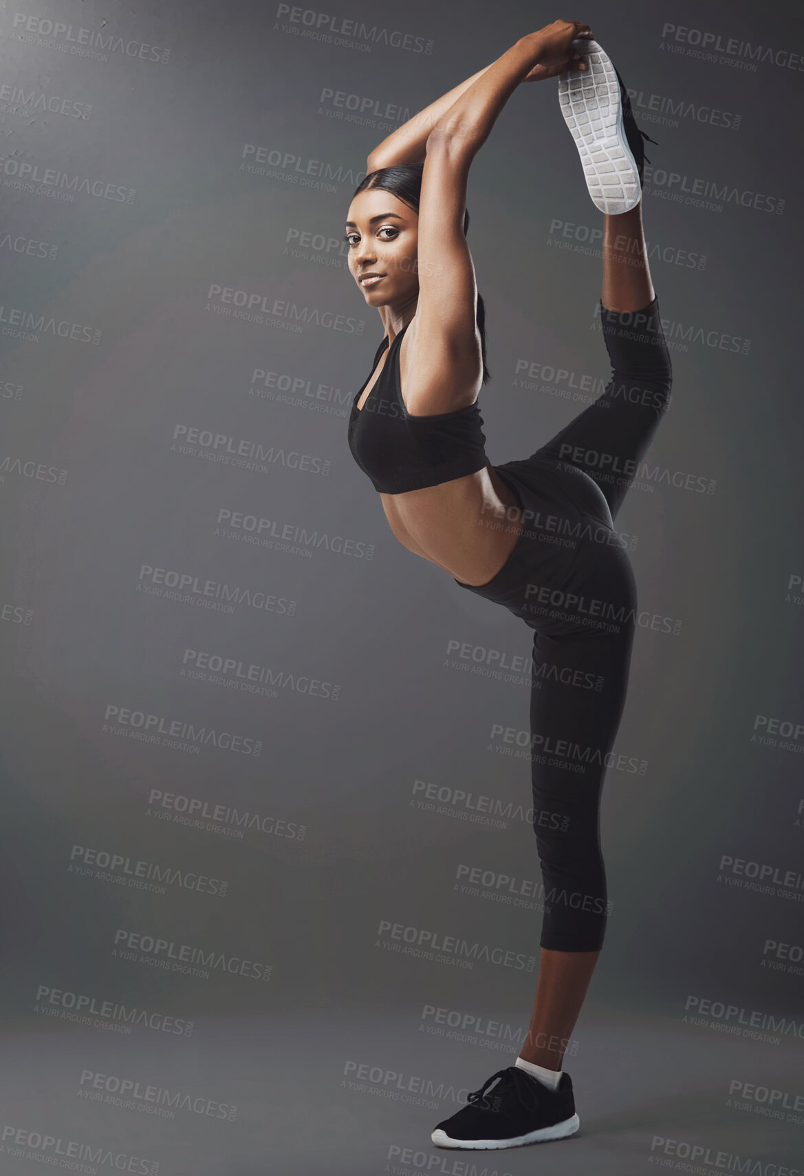 Buy stock photo Fitness, legs and woman stretching in studio for exercise with mockup space for body training. Sports, warm up and portrait of Indian female athlete with workout for wellness by gray background.