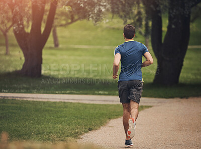 Buy stock photo Running, back and man in park for fitness, cardio and exercise on pathway. Male athlete, jogging and training in nature for energy, marathon challenge and healthy lifestyle or aerobic activity