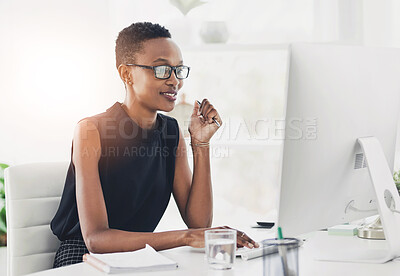 Buy stock photo Black woman, computer and office with working as creative director for magazine, publication or company. Female person, African and typing with thinking, happy and job for deadline, project and brief