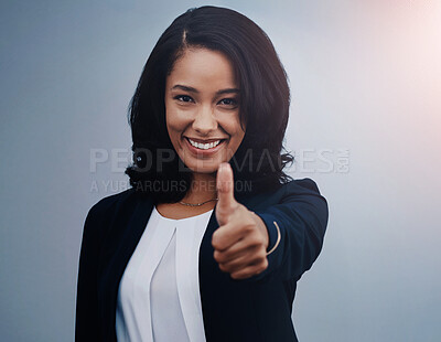 Buy stock photo Happy, business woman and portrait with thumbs up for winning, good job or success on a blue studio background. Female person or employee with smile, like emoji or yes sign for well done or thank you