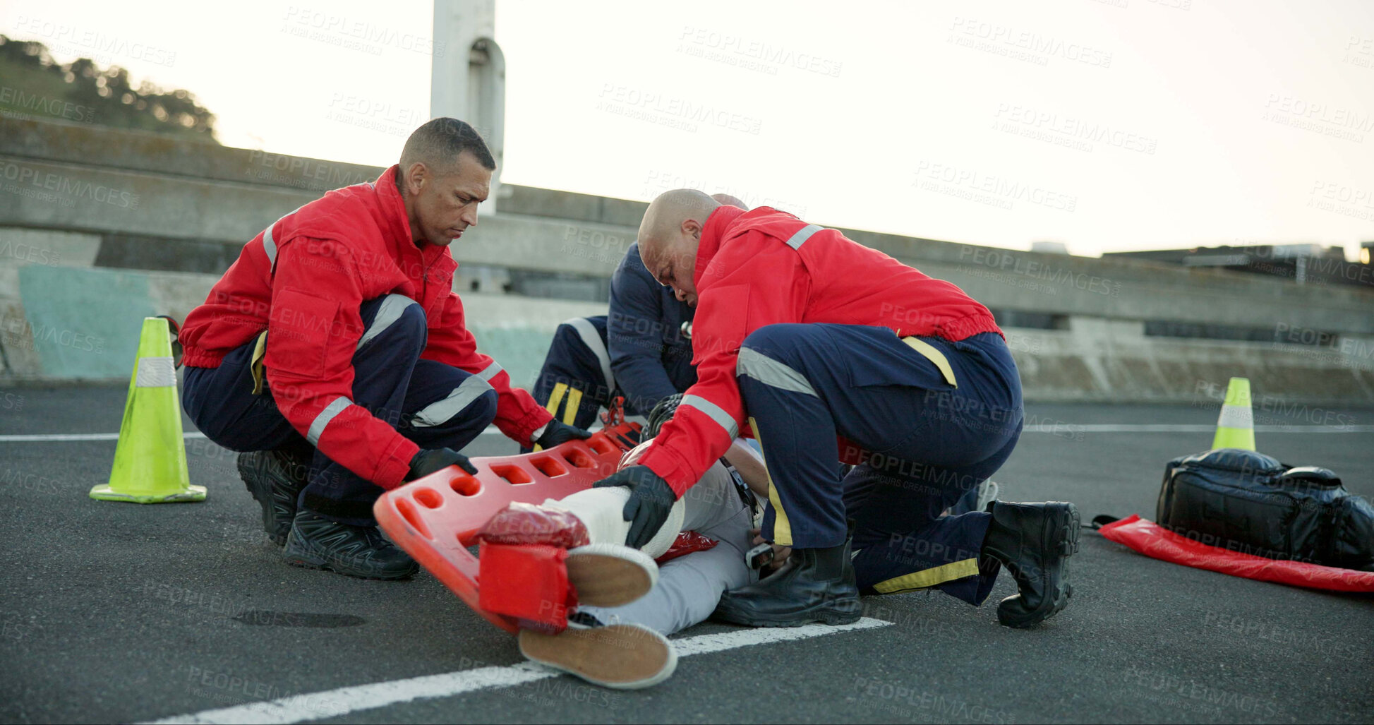 Buy stock photo People, paramedic and help patient in road on scene for emergency, rescue and support. Emt team, healthcare and stretcher for injured person on accident for medical service, care and first aid