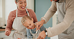 Happy family, child and baking with bowl for mixing ingredients, bonding or hospitality together in kitchen at home. Mother and father helping daughter, kid or little girl with whisking for dessert