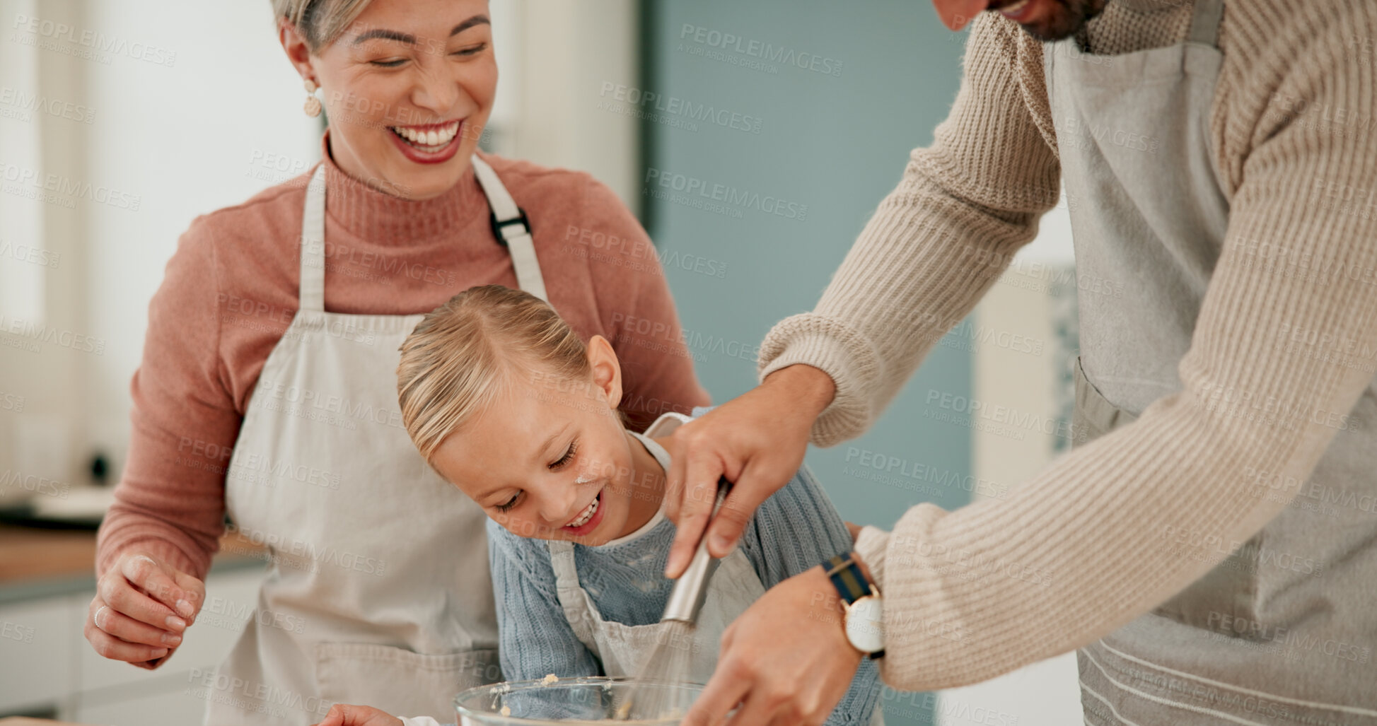 Buy stock photo Happy family, child and baking with bowl for mixing ingredients, bonding or hospitality together in kitchen at home. Mother and father helping daughter, kid or little girl with whisking for dessert