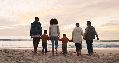 Buy stock photo Family, walking and holding hands at ocean in summer for relax, travel and vacation as happiness. People, children and back at beach with solidarity for holiday, trust and love together by water