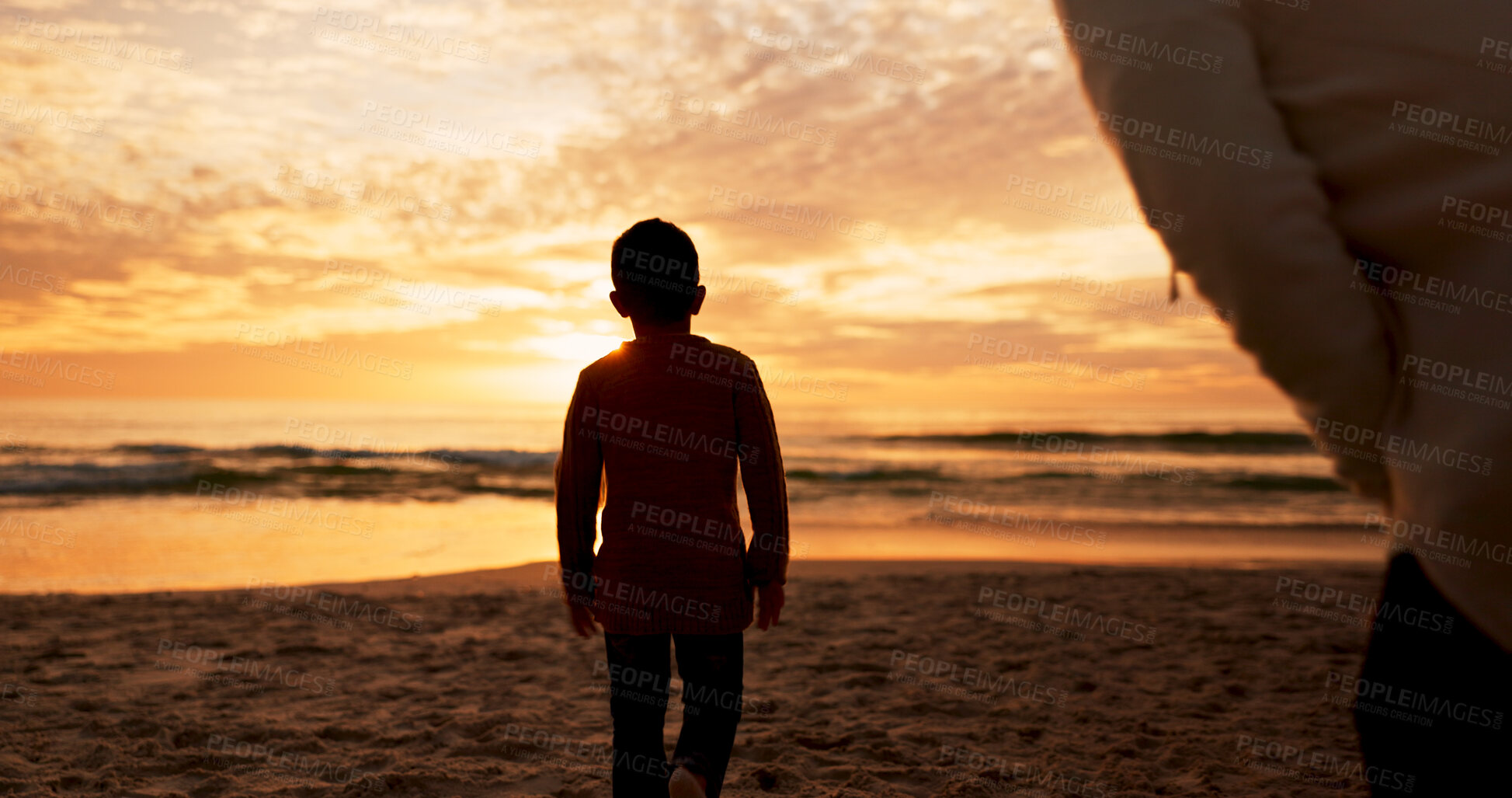 Buy stock photo Boy, mother and walking at sunset on beach, travel and explore nature or waves of ocean on vacation. Kid, mommy watch and sea for wellness or back in Florida on weekend, water and holiday adventure