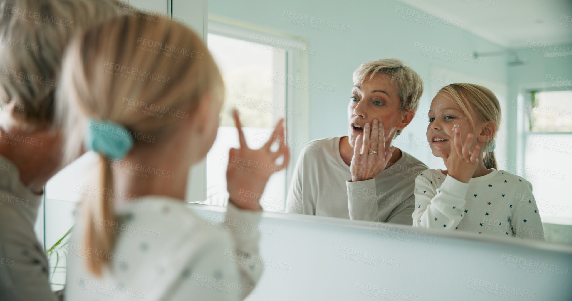 Buy stock photo Child, grandmother and morning routine in bathroom for growth, development and motor skills in home. Young person, girl and senior woman with skincare, education and fun as youth or kid in bonding
