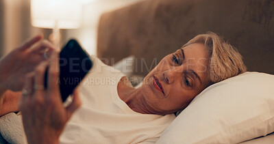 Buy stock photo Reading, bed and senior woman with phone for online blog on insomnia, sleep apnea or relaxing. Communication, night and mature female person networking with email on smartphone in bedroom at home.