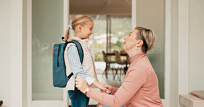 Buy stock photo Mom, girl and happy at front door to school or education with pride, love and home. People, parent and kid or daughter with smile in morning with goodbye, support and excited for first day with trust