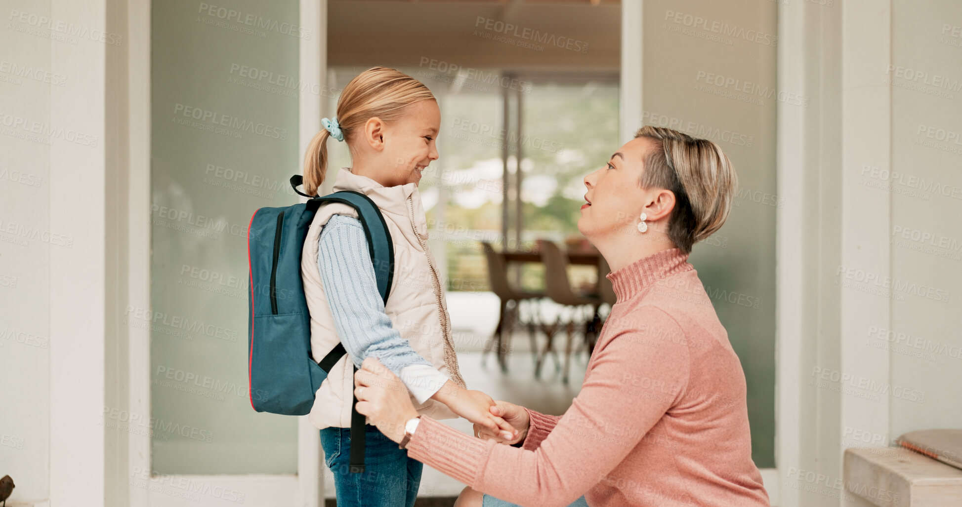 Buy stock photo Mom, girl and happy at front door to school or education with pride, love and home. People, parent and kid or daughter with smile in morning with goodbye, support and excited for first day with trust