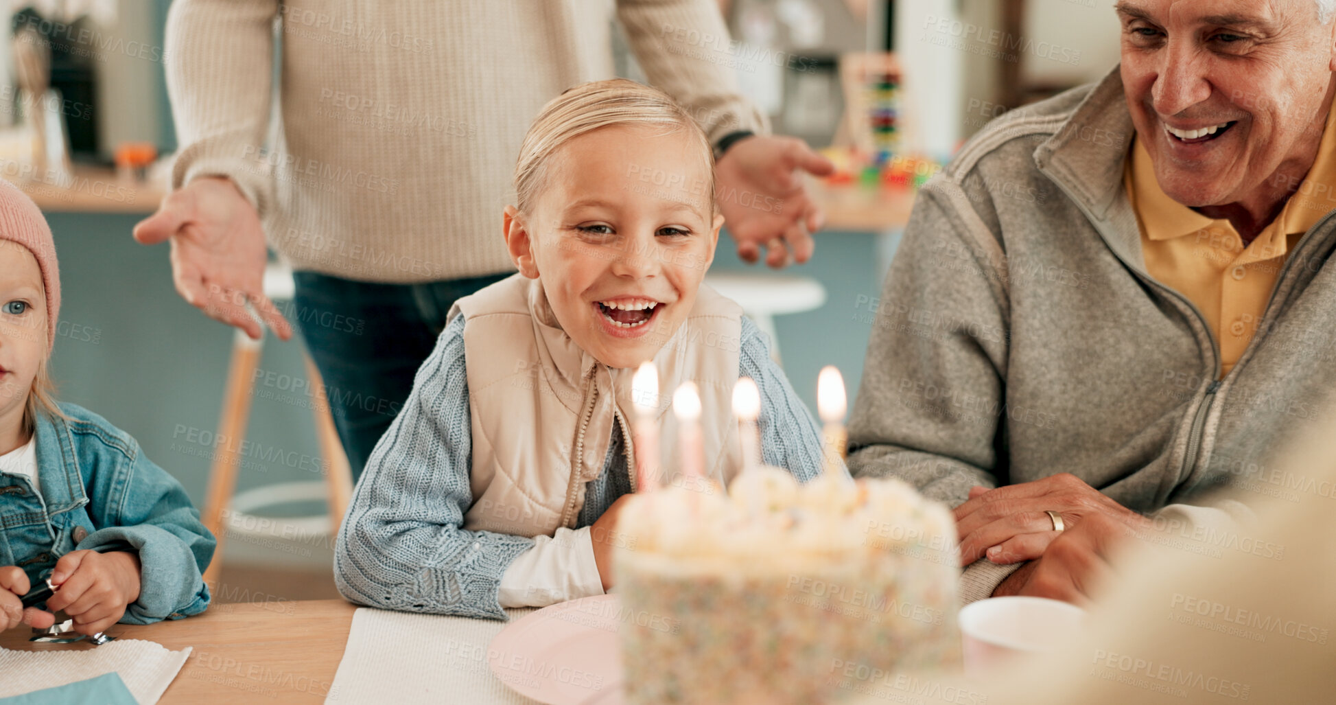 Buy stock photo Happy girl, candles and birthday with cake by family for celebration, wish or dessert together on dining table at home. Excited child, daughter or kid with smile, grandparents or party for childhood