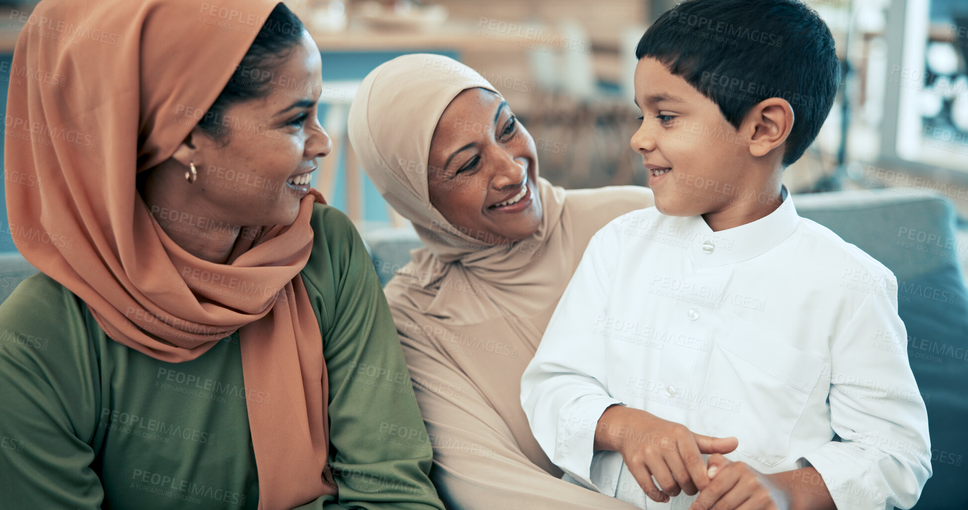 Buy stock photo Muslim family, happy and son on sofa in home, together and smile or child bonding for Muharram celebration. Hijab woman, traditional and arabic clothes in living room, grandmother and islamic house