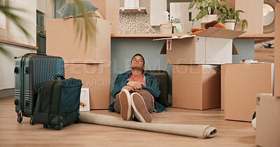 Buy stock photo Man, boxes and sleeping on floor in new house with fatigue from travel, immigration and real estate investment. Person, tired and rest for relief, security or property with luggage for moving to home