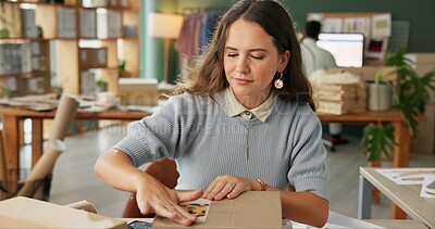 Buy stock photo Woman, startup and package label for delivery of e commerce order, shipping information and courier. Female owner, logistics and box with business sticker, stock packaging and process of distribution