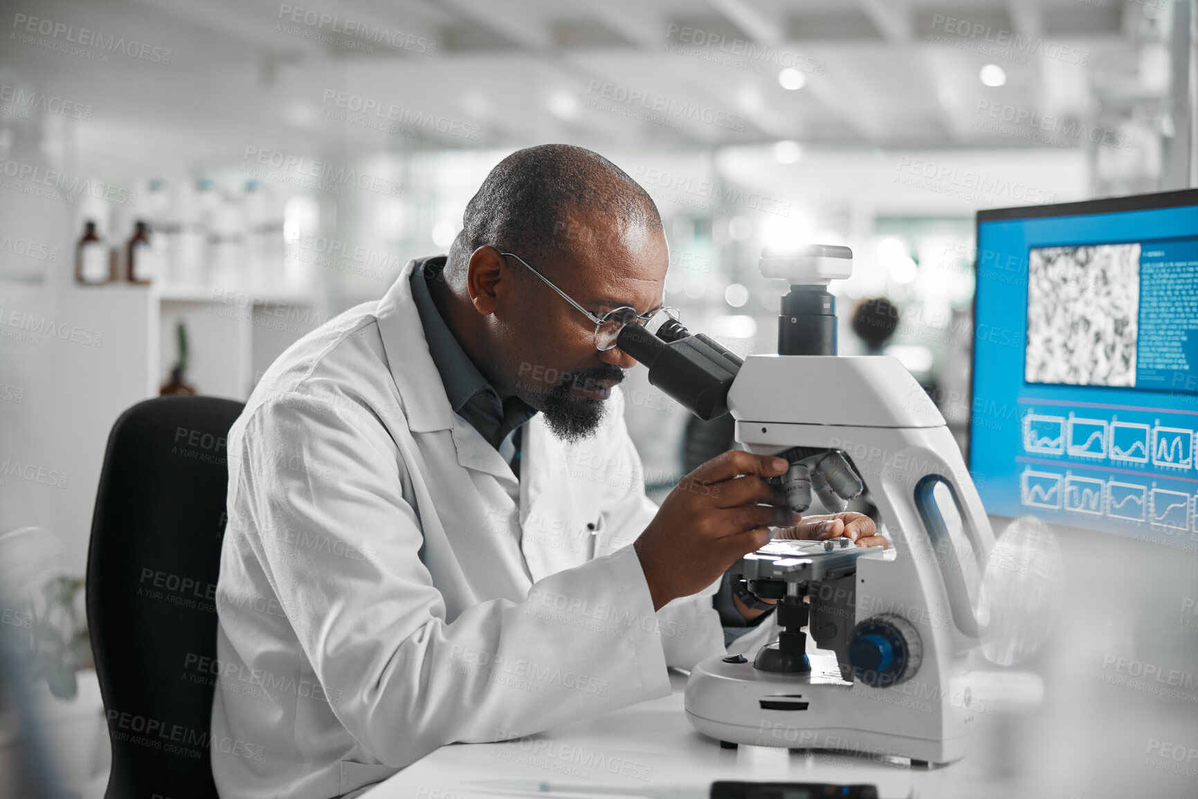 Buy stock photo Science, black man and development with microscope in lab for investigation, research and dna test. Mature scientist, innovation and biotech with review for stem cell, growth or report in vaccinology