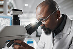 Black man, medical science and microscope in laboratory for analysis, innovation and results or research. Development, glasses and professional scientist in hospital for wellness, cure or health care